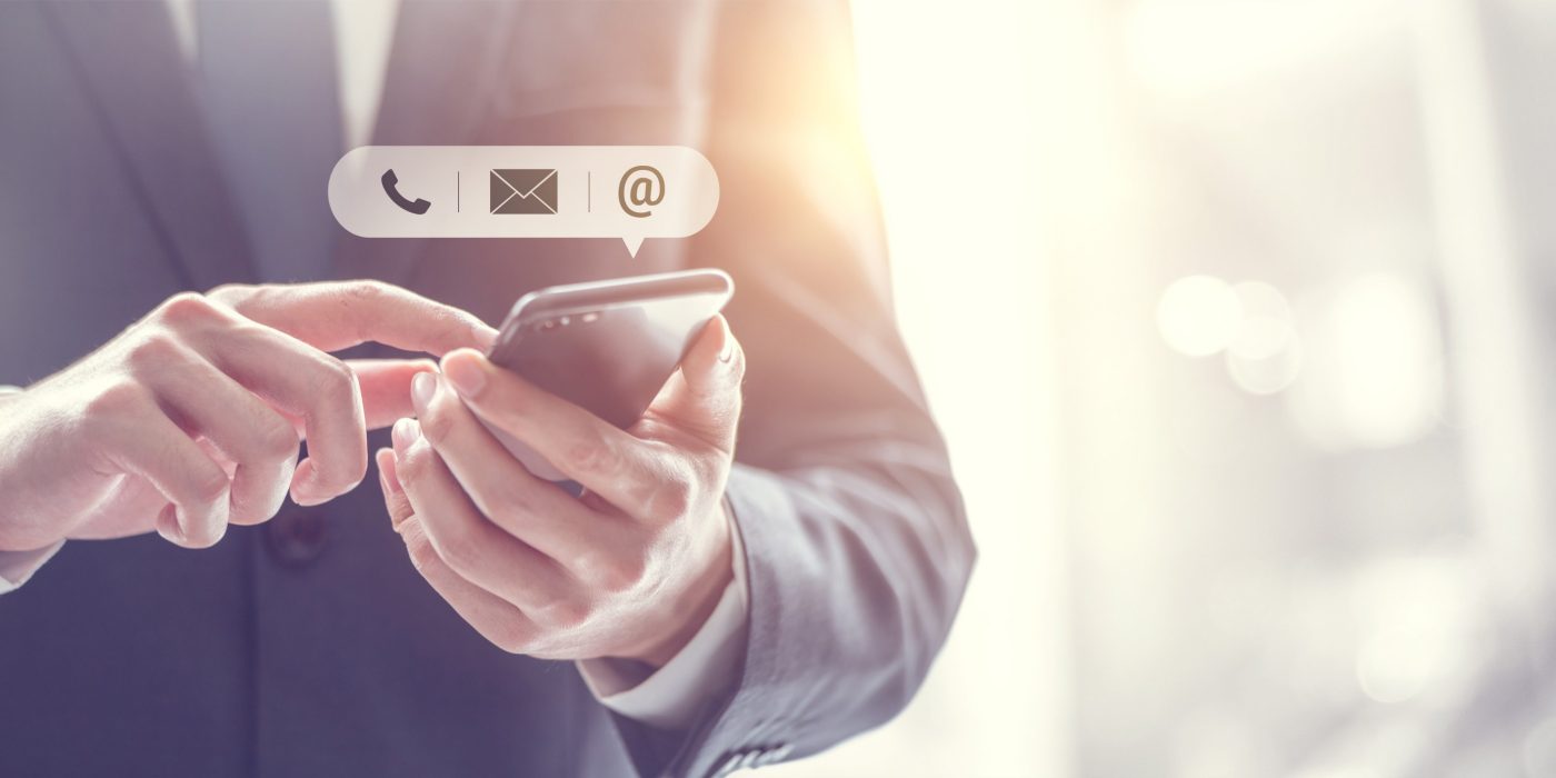 CONTACT US, Hand of Businessman holding mobile smartphone with ( mail,phone,email ) icon. customer support concept, copy space.