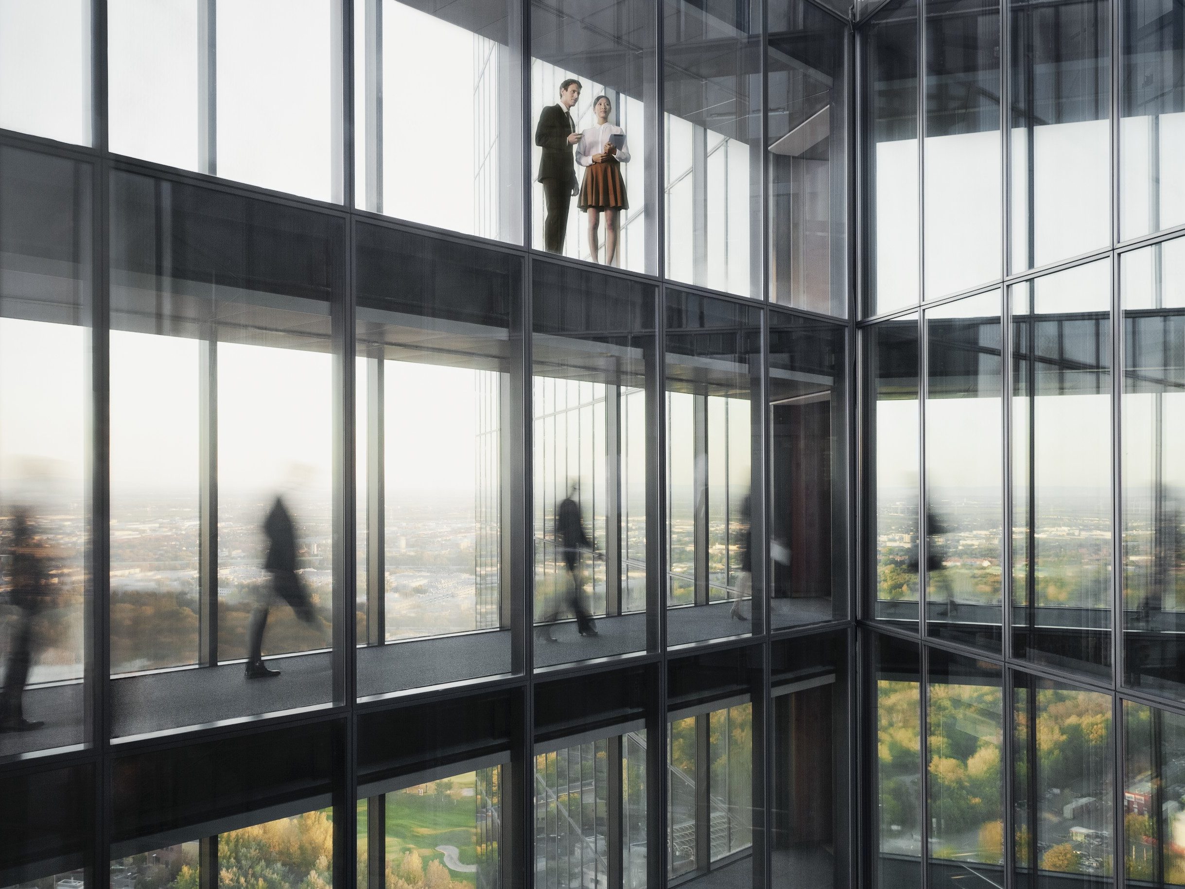 People walking on connecting bridges at Vienna Twin Towers